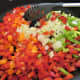 Saute the onions and peppers until softened
