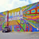 Mural at 420 Travis Street in Houston by Aerosol Warfare