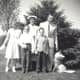 My family in June of 1958.  My brother John is holding his first Holy Communion candle.