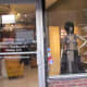 An uniquely designed outfit is displayed within Jacqueline's window downtown Chester.