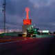 A futuristic, neon spire greets commuters