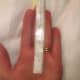 Measure from the second lateral line up to the top of the ring finger. Note the number of inches to the 1/8".