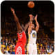 Stephen Curry shoots over James Harden of the Houston Rockets.