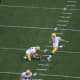 Mason Crosby practicing kicking a field goal.