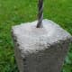 I made up 4 supports from concrete "soap bars" and waste blocks to space the rebar 1/3 of the way up from the bottom of the hole.