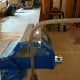 Bending steel rebar in a vice.
