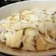 Onion slices over the potatoes