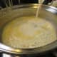 Milk added to pan with butter and flour mixture