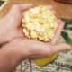 Remove from heat. Butter hands and begin forming popcorn into balls using light, but firm pressure.