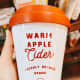 A warm apple cider scented candle