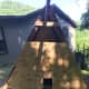 I cut sheets of plywood to fit the triangle frame that would be inside of the pen. I cut a little duck sized door at the bottom.