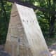 I used another sheet of plywood cut to make a triangle-shaped wall. Two doors were cut into the wall. The top door was on top of the climbing tower making a great storage area. The bottom door was to the duck house where they would sleep.