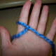 Wrap yarn in front of pointer finger,then back and all the way around finger.