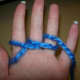 Wrap yarn back and around ring finger.