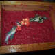 The embellishment will set into the pulp as you pull the deckle out of the water.
