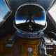 A SR-71 pilot in his pressurized suit whose helmet's visor captures the inky blackness of near space as the plane reached altitudes of over 80,000.