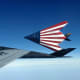 Two F117s on the way to an airshow with the American flag painted on the bottom of the aircraft.