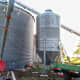 The bin and hopper were erected on top of steel barrels cut in half and filled with concrete.