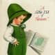 Vintage kids: Little boy in green short overalls, reading "A little bit of Heaven" "Tis the shamrocks on St. Patrick's Day that bring back memories dear and gay"