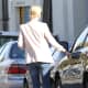 Charlize Theron seen getting in her car  in a stylish jeans and jacket look