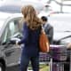 Elizabeth Hurley waiting on her car at the airport in a hot view from behind