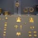 Fine gold jewelry, including butterflies and stylized buildings, from Mycenae.