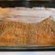 #6- Add a thin layer of nuts. Approximately 1/3 cup. Then begin to lay crumpled layers of Fillo to fit your pan. Usually, 4-5 fillo will work.