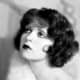 Clara Bow circa 1927, wearing curly medium length bob hair style