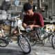 Craftsman makes famous antique bicycle miniature in his simple workshop in villages around Yogyakarta City, Central Java Province, Indonesia