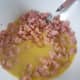Mix egg and milk mixture with ham