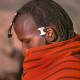 After circumcision, the young warriors grow their hair again and spend a great deal of time styling it. The plaited hair is dressed with animal fat and ocher, and parted across the top of the head at ear level.