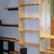 Adjustable shelves with hewn effect.