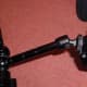 An 11 inch articulating magic arm and support clamp for attaching additional camera equipment e.g. 7 inch LCD.