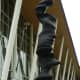 Closeup photo of the skinnier sculpture. See the faces?