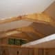 View of ceiling showing concept of double insulation. Used scraps of insulation to seal off attic so air conditioner could be used while installing insulation in walls.