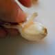Your garlic clove is now ready to peel.  Cut off top and bottom ends.  Be careful not to cut too much!