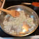 Add onions to skillet and stir.  Reduce heat to medium and allow onions to cook until translucent.  Stir frequently.