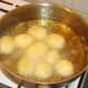 Peeled potatoes are deep fried