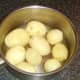 Boiled and cooled potatoes are peeled