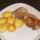 Turkey meat and potatoes are plated