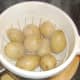 Boiled potatoes are drained and allowed to steam for five minutes