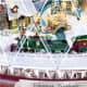 Miniature animated train circles the Christmas village.