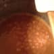In a few minutes, you'll notice that it starts to bubble because it is going to boil. Stop stirring and set the timer for 5 minutes.