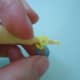 You can also do this step without a loom. Just insert 6 rubber bands one at a time through a cap band (double or triple loop) to get the same result.