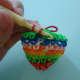 Pull the rubber band through the loop as usual. But do not get the rubber band at the back just yet.