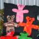 All around 10-12" tall, a variety of knit colorful teddy bears.