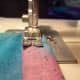 Sew one inch in and then reverse to the end. Then go forward again slowly creating a straight stitch.
