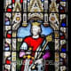 Stained glass window of a church picturing Alfred the Great in Hampshire, England
