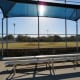 Shaded seating for viewers of baseball games in Freedom Park