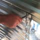 Punches are inserted at eight end of a wall sheet when fitting it into place, both to hold it and to provide leverage to align bolt holes.